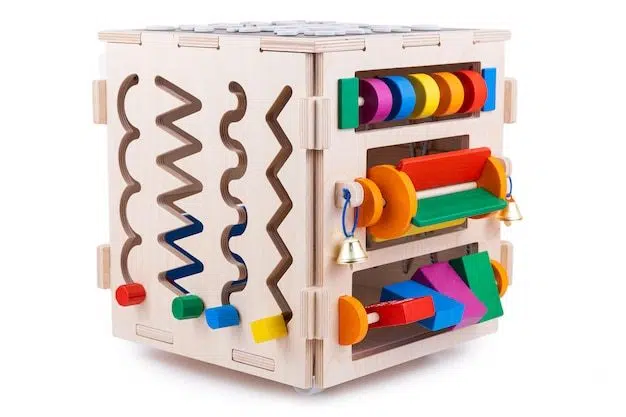 Wooden eco-friendly busy board house. educational toy for children Premium Photo